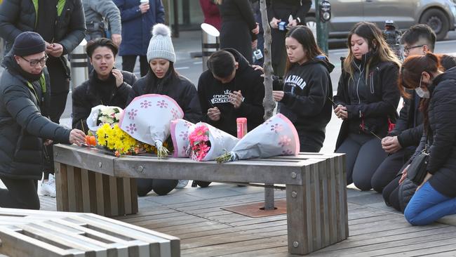 Mr Tran’s friends gathered at the scene. Picture: David Crosling