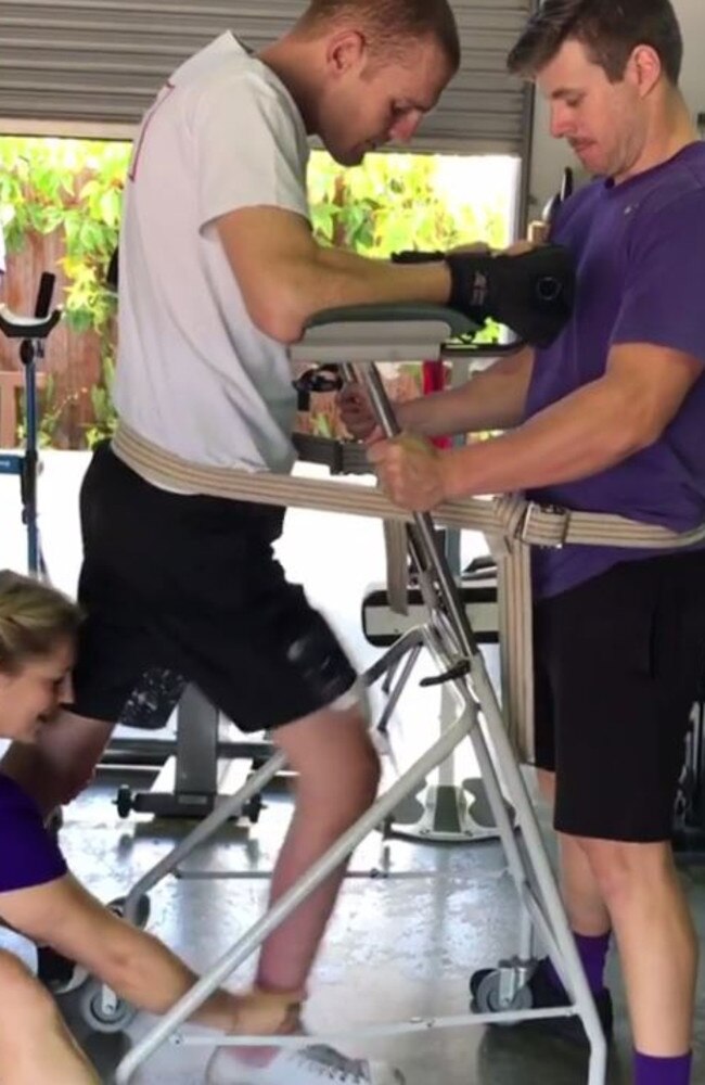 McKinnon walking with assistance during rehab at Gold Coast's Making Strides.