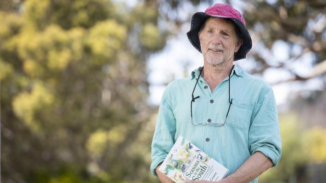 Author Simon Grove with his book titled Seasons in the South. Picture: Chris Kidd