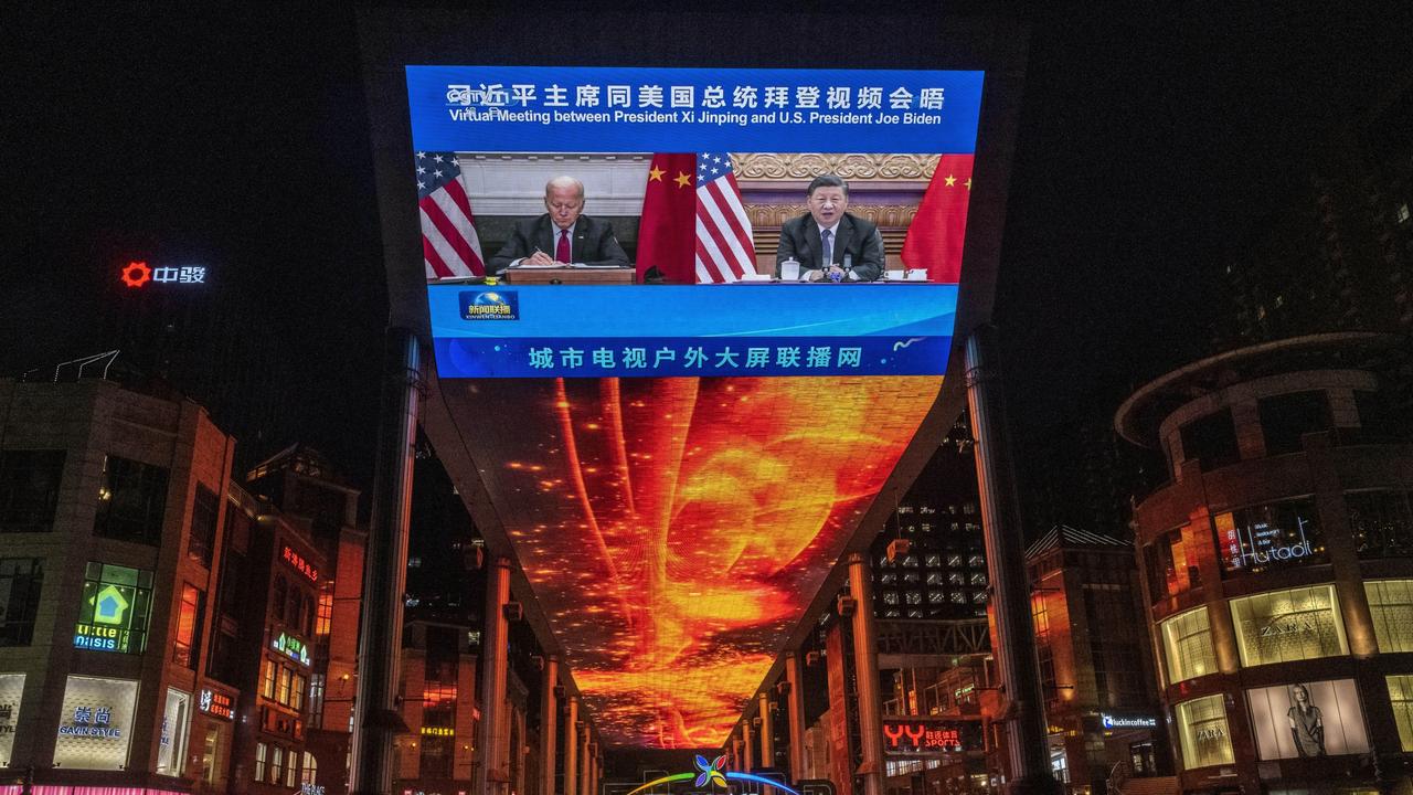 A large screen in Beijing displays United States President Joe Biden, left, and China's President Xi Jinping. Picture: Kevin Frayer/Getty Images.