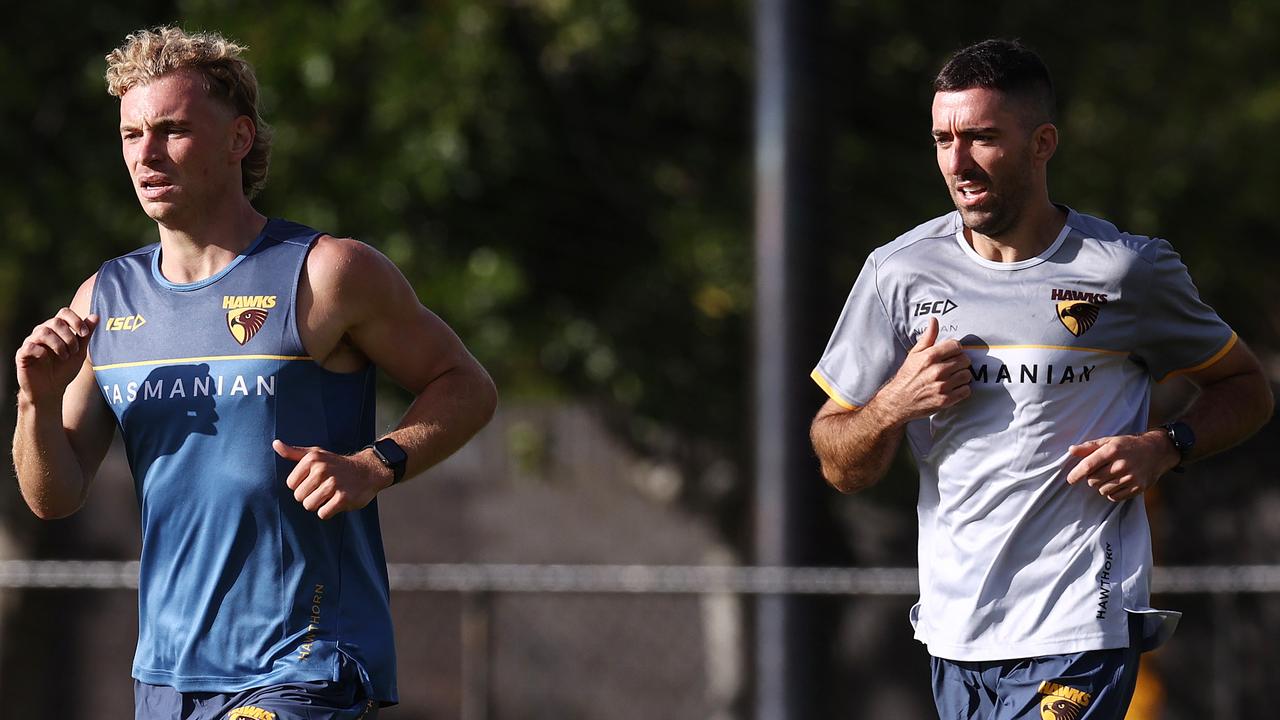 James Worpel runs with assistant coach Kade Simpson at training. Picture by Michael Klein