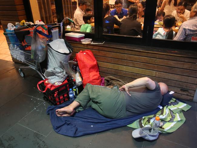 Homeless people on Swanston St, Melbourne. Picture Yuri Kouzmin