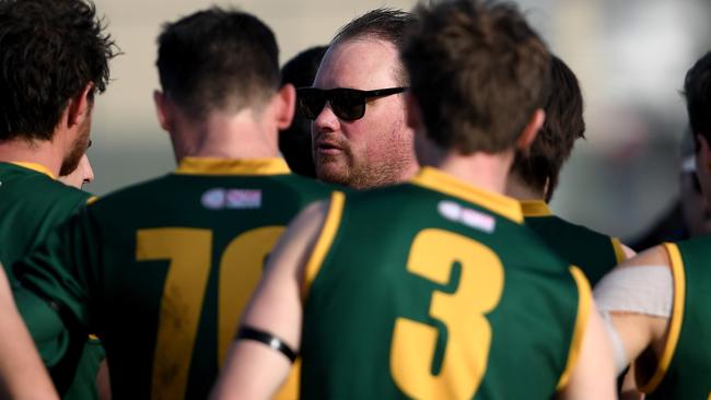 John Garrard talks to his players. Picture: Andy Brownbill