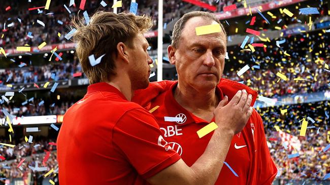 Sydney Swans captain Callum Mills and coach John Longmire leave the field after losing to the Brisbane Lions in the 2024 AFL Grand Final at the MCG on September 29, 2024. Photo by Phil Hillyard(Image Supplied for Editorial Use only - **NO ON SALES** - Â©Phil Hillyard )