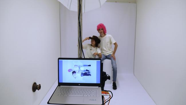 Thomas Breitenstein and Dasom You demonstrate their new 'self-portrait studio' the latest addition to their popular photo booth shop Pikapic, where customers can take their own professional self-portraits. Photo: Catherine Duffy