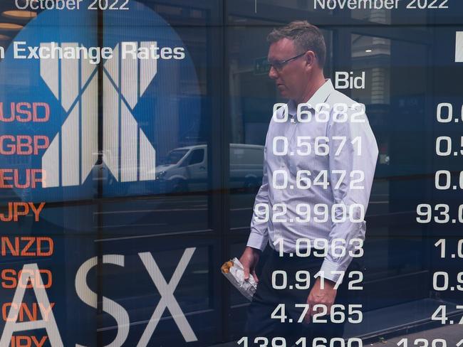 SYDNEY, AUSTRALIA - Newswire Photos -November 14, 2022 A general view of members of the public walking past the digital boards at the ASX in Sydney. Picture: NCA Newswire / Gaye Gerard