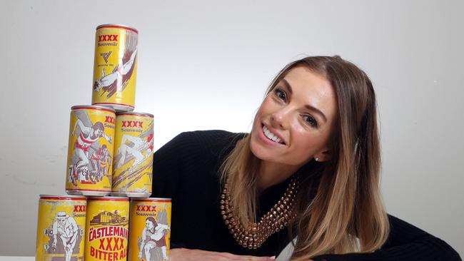 Pippa Jeffries looks at a collection of the 1982 beer cans obtained by GOLDOC. Photo by Richard Gosling