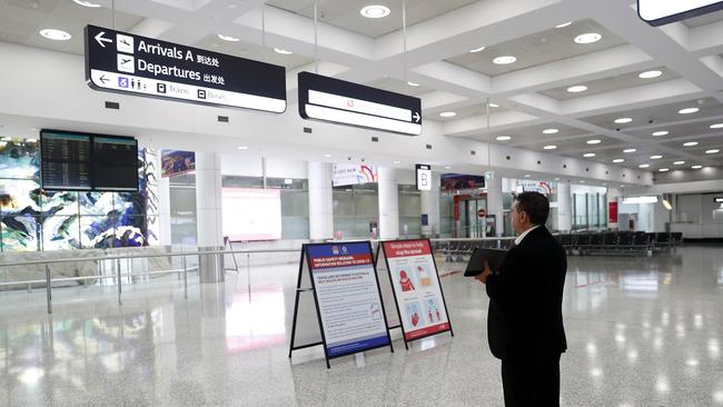 A driver waits for arrivals at Sydney International Airport on Friday 27 March 2020. Picture: Nikki Short