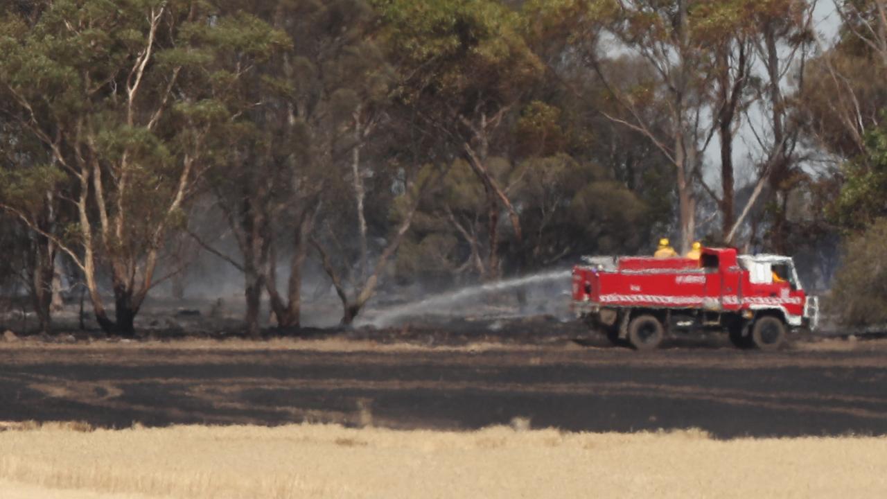 Fire crews get a grass fire under control near Shelford, about 11km from the Beyond The Valley music festival on Monday afternoon. Picture: Alan Barber