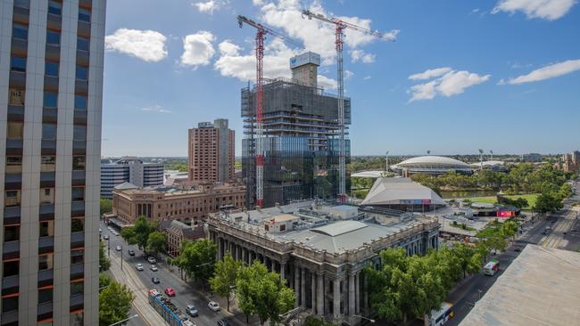 One Festival Tower rises over Parliament House in January. Picture: Ben Clark