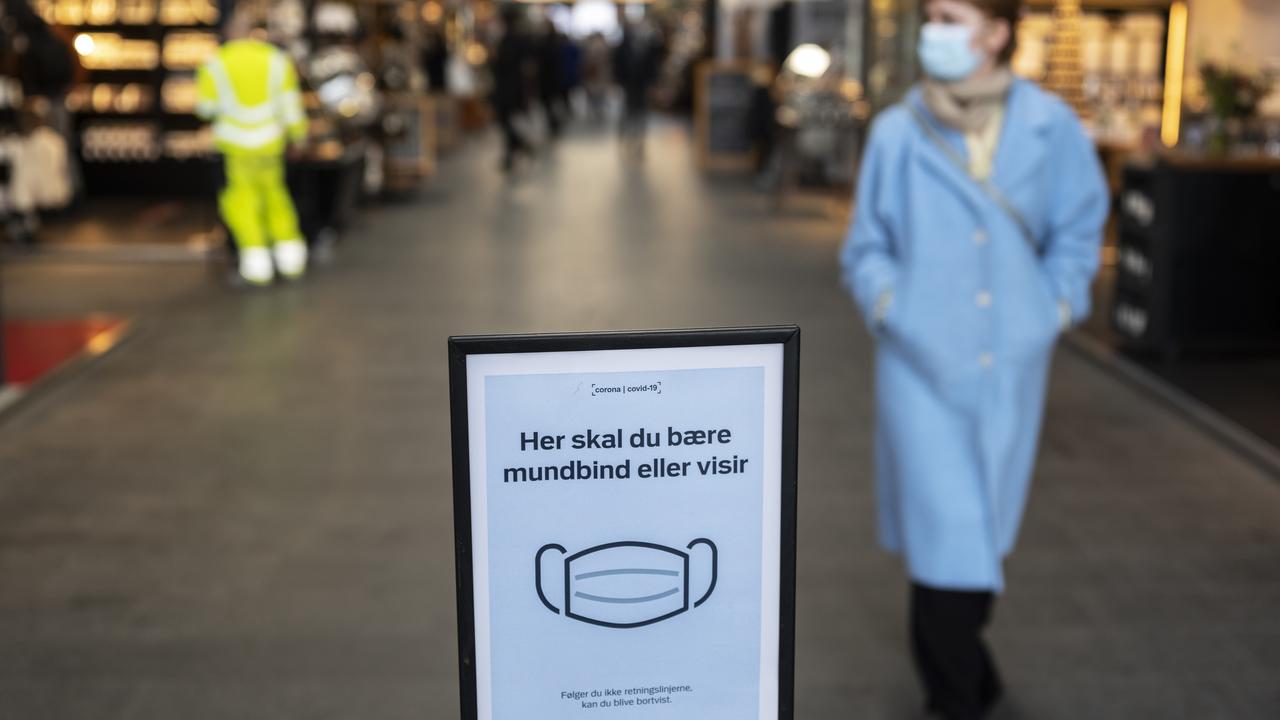 A sign requests visitors to wear masks in Copenhagen, Denmark. Picture: Carsten Snejbjerg/Bloomberg via Getty Images