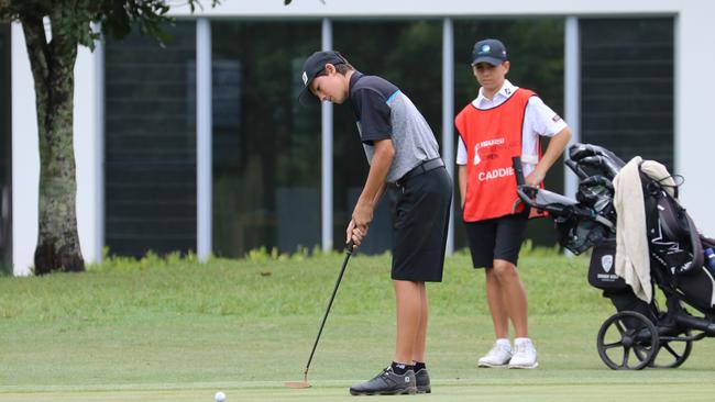 Surfers Paradise Golf Club's Bill Dowling, just 15, and his even younger caddie Alfie Ward, 13, team up for their day out at the Isuzu Queensland Open at Pelican Waters on Thursday. Photo: Kirsty Wrice, Golf Australia