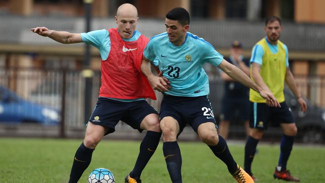 Socceroos midfielders Aaron Mooy (left) and Tom Rogic at training in Malaysia ahead of the World Cup playoff against Syria.