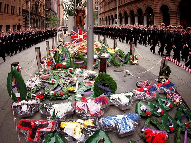  Navy personnel march through Martin Place past the Cenotaph during the Anzac Day commemorations. Picture: Renee Nowytarger. 