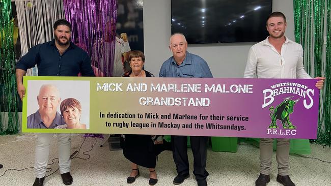 Bryce Fraser, pictured far left, says a more accurate reflection of the Brahmans' culture can be found in committee president and treasurer Mick and Marlene Malone – two 'absolute stalwarts' who've contributed about 20 years to keeping the club going strong. They are pictured receiving their recent Les Stagg Oval grandstand dedication, with 2021 head coach Adam Crear. Picture: Supplied