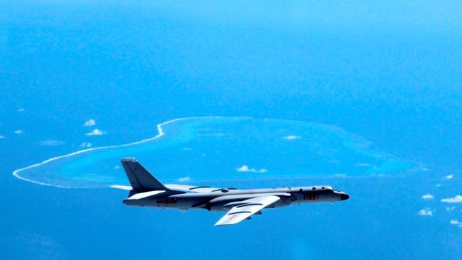 Aa Chinese H-6K bomber patrols the islands and reefs in the South China Sea. China appears to be making a new move on a sandbar in the Spratly Islands. Picture: AP