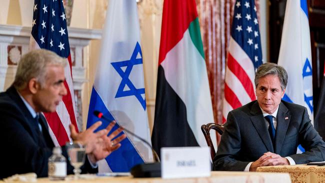 US Secretary of State Antony Blinken, right, listens to Israeli Foreign Minister Yair Lapid address media at the State Department in Washington on Wednesday. Picture: AFP