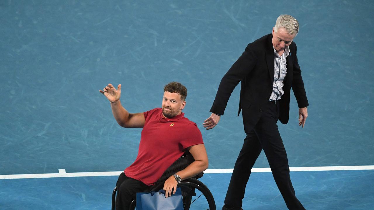 Dylan Alcott entered Rod Laver Arena for his farewell lap with Craig Tiley. Picture: AFP