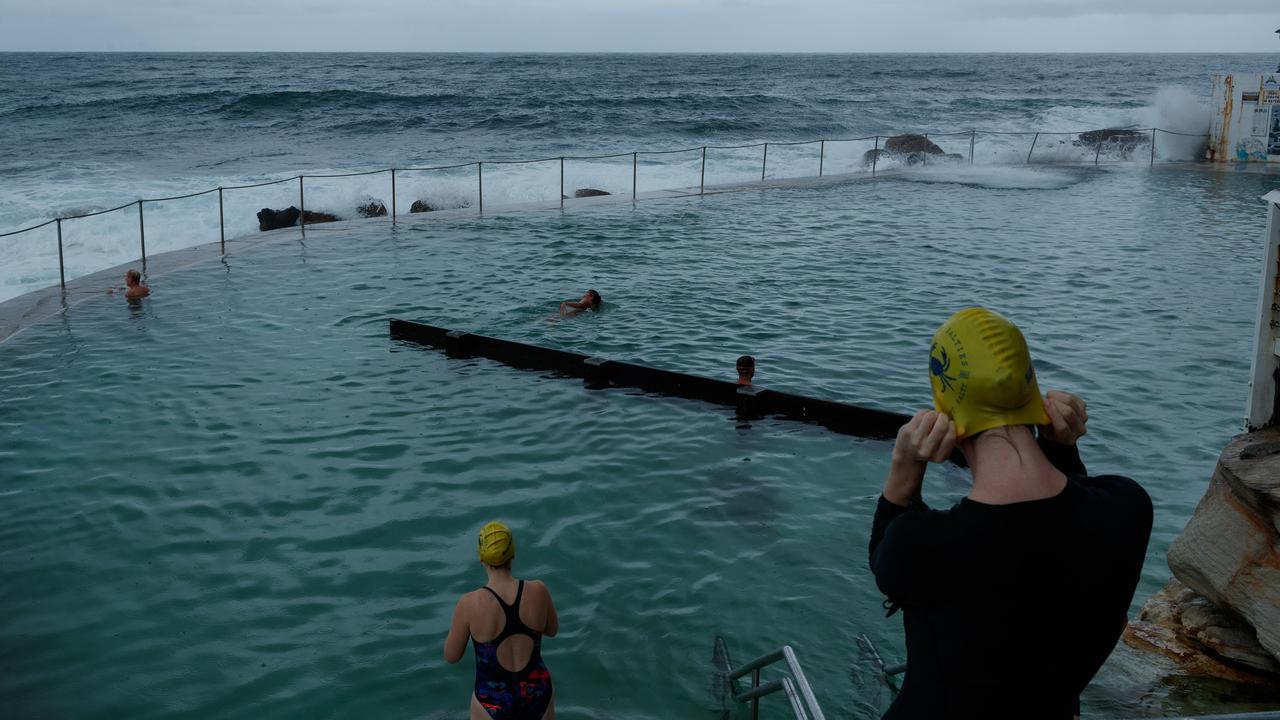 Bathers brave the weather at Bronte Beach. A severe surf weather warning was brought in statewide. Picture: NCA NewsWire / Max Mason-Hubers