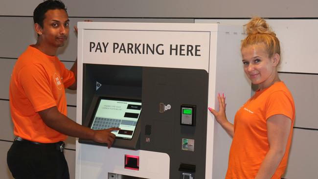 Rajneet Lal and Rebecca Richards demonstrate the new pay stations. Picture: Ian Svegovic