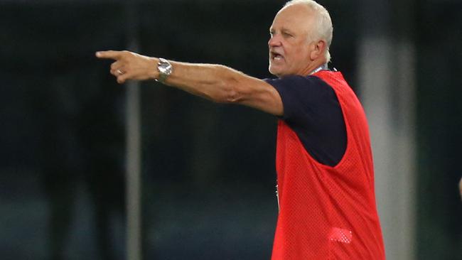 Australia's coach Graham Arnold speaks to his players during the 2022 FIFA World Cup qualification group B football match between Australia and Kuwait at the Jaber Al-Ahmad Stadium in Kuwait City on June 3, 2021. (Photo by Yasser Al-Zayyat / AFP)