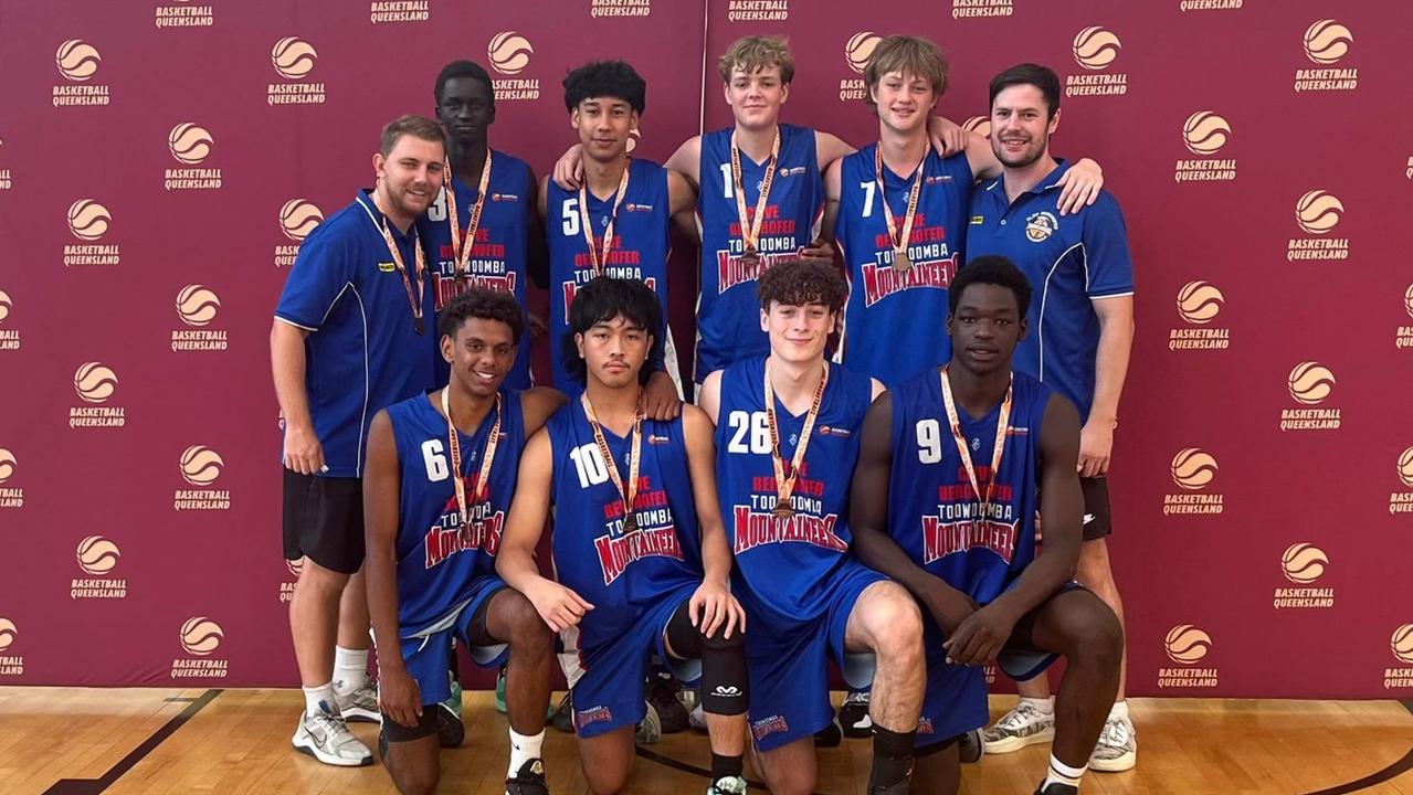 Toowoomba Mountaineers players celebrate their bronze medal at the Queensland Basketball Under-18 State Championships.