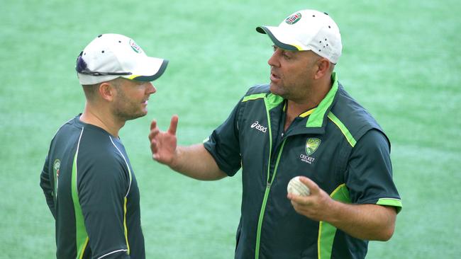 Michael Clarke (R) and Darren Lehmann share a words at Aussie training. Picture: Mark Cranitch.