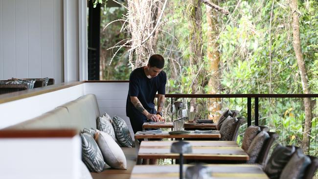 Gonzo Behr sets restaurant tables at Silky Oaks Lodge at Finlayvale, north of Mossman. Picture: Brendan Radke