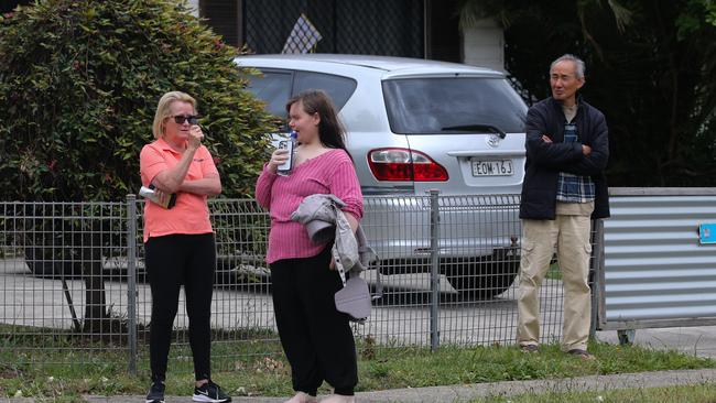 Nearby neighbours left their homes to see the extent of the crash. Picture: NCA Newswire / Gaye Gerard