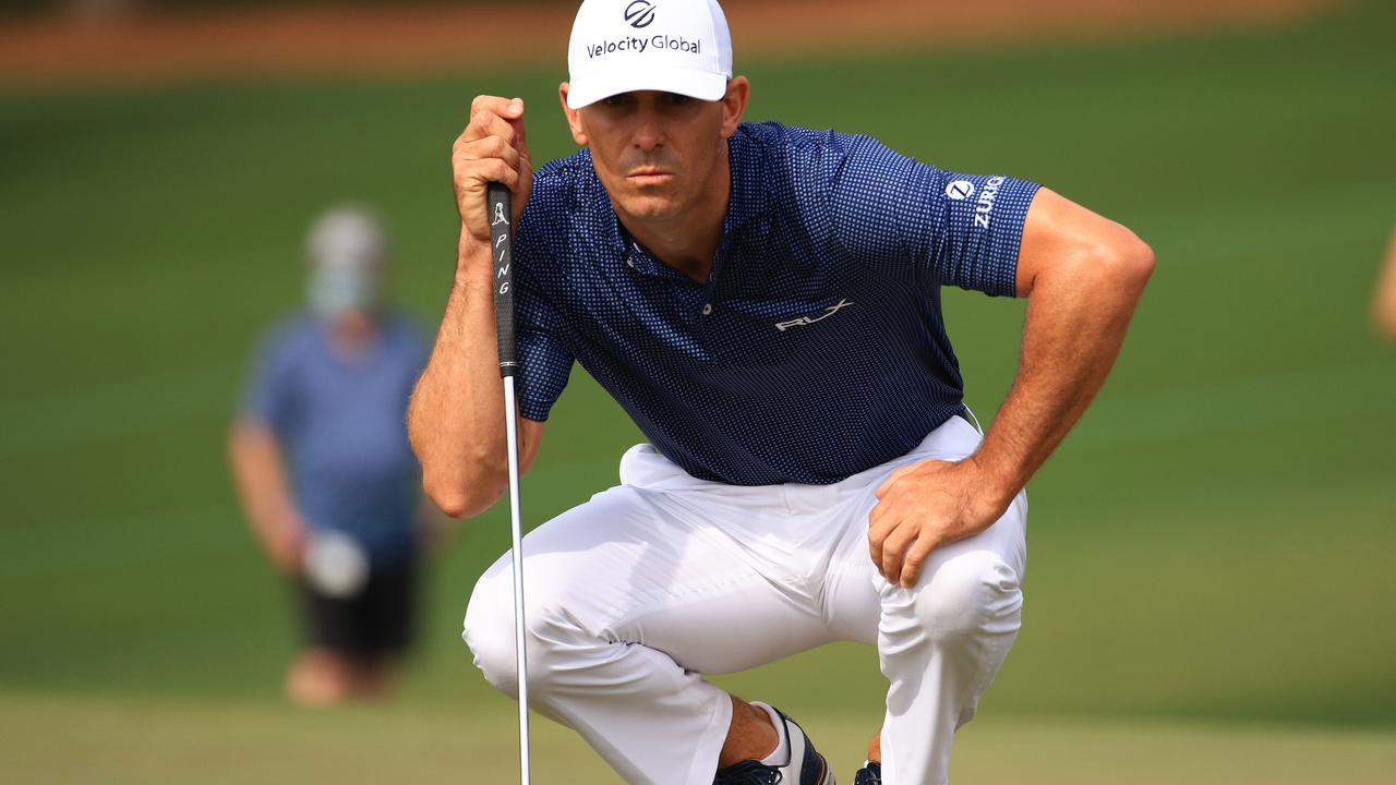 Billy Horschel of the United States lines up a putt on the second green.