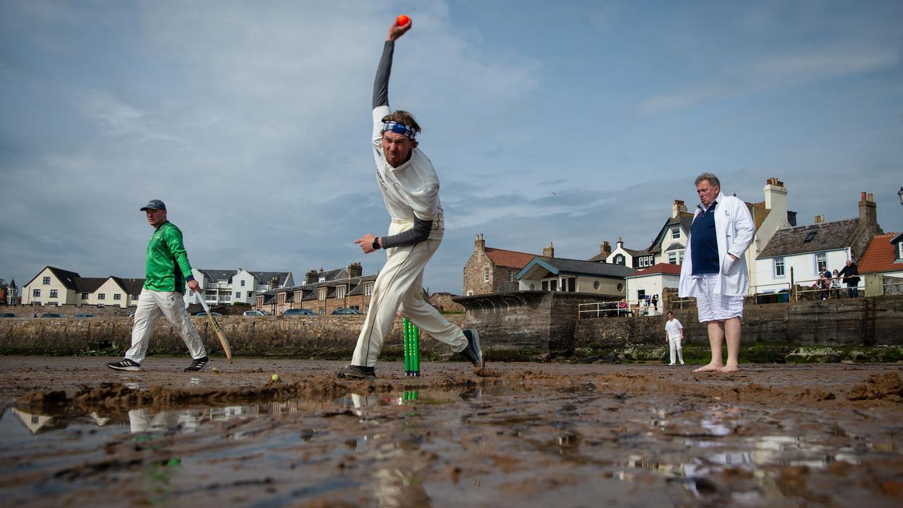 Players from the Ship Inn CC and The South Street Swingers CC, a team made up of ex-Edinburgh University team members, play a game of cricket on the beach at Elie in eastern Scotland. The Ship Inn Cricket Club has been playing on the beach at Elie for over 30 years. Picture: Andy Buchanan/AFP