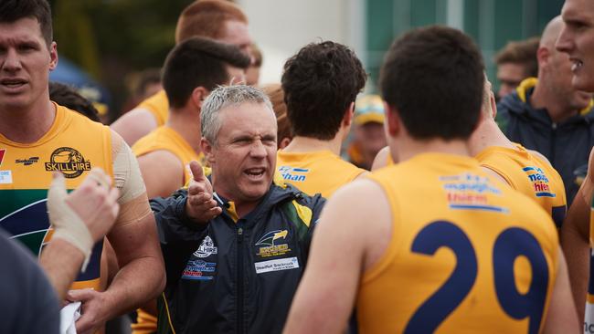 Eagles coach Michael Godden talking to players at a quarter break.