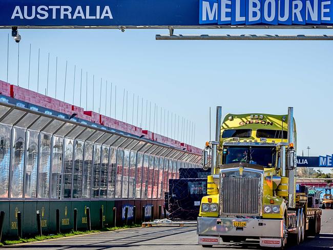 Photo: Hamish BlairA freight truck drives down pit straight as set up continues for the upcoming F1 Grand Prix at Albert Park on Sunday, March 9, 2014 in Melbourne, Australia.