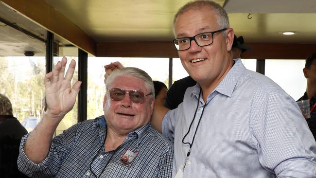 Prime Minister Scott Morrison grabs a beer with Stuart Macdougall — Wallaby 71 to 76. Picture: Chris Pavlich