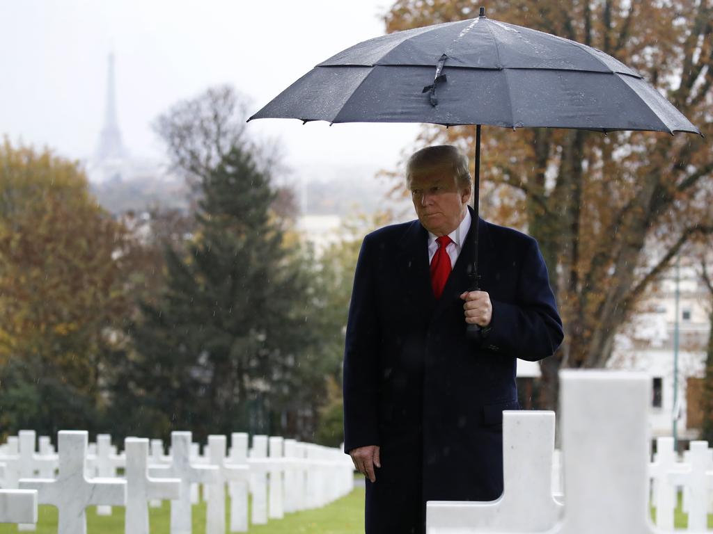 President Donald Trump stands among the headstones during an American Commemoration Ceremony in Paris on Sunday. Picture: AP Photo/Jacquelyn Martin