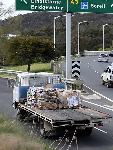 The back of a small rubbish truck blew off on the Tasman bridge creating traffic chaos for city-bound traffic. Picture: Sam Rosewarne