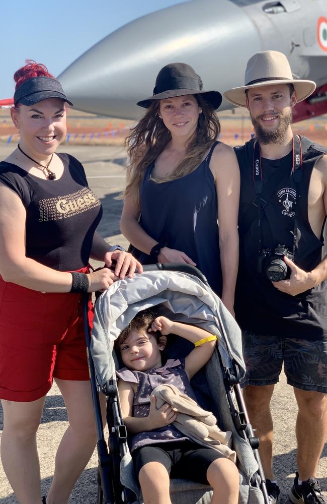 Checking out the sights are (back, from left) Sam Kouklinos, Jana Knerr and Lachie Brett with Athena Kouklinos, 3, along for the ride at the Pitch Black Open Day at RAAF Darwin. Saturday, August 27, 2022. Picture: Tara Miko
