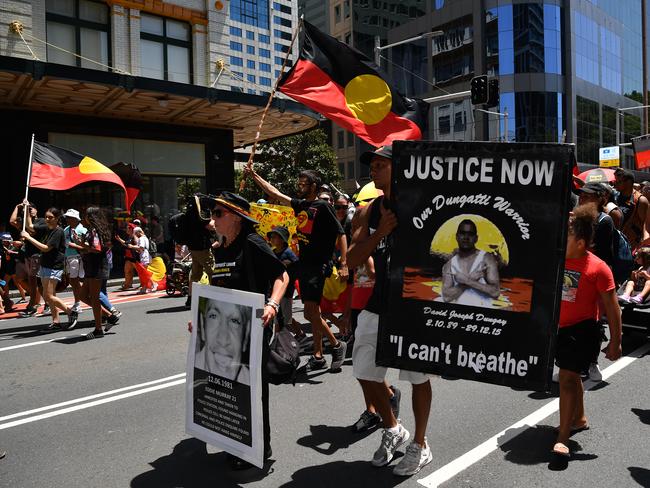 Protestors take part in an Invasion Day Rally in Sydney. Picture: AAP