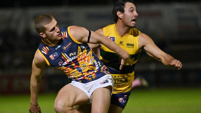 Eagle Daniel Menzel battles Adelaide’s Andrew McPherson for the ball at Woodville Oval on Friday night. Picture: Keryn Stevens.