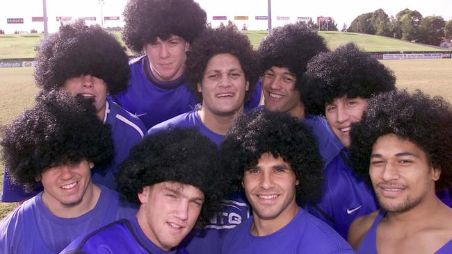 Bulldogs forward Willie Mason and teammates wearing ’Willie Wigs’ in 2002. Picture: Roy Haverkamp.