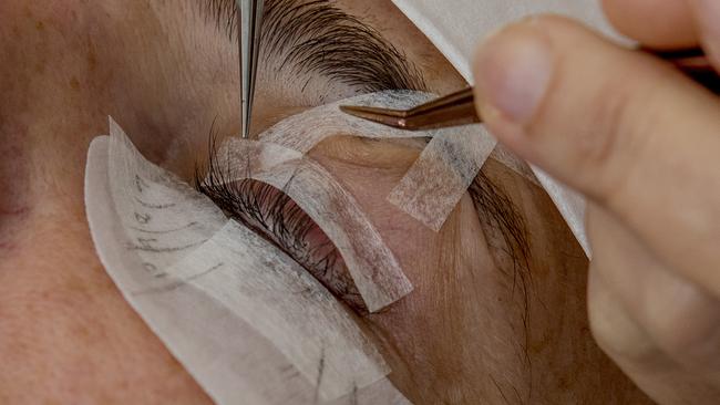 Eyelash Extension Institute student Kate Dean working on model Tanya Knapp. Picture: Jerad Williams