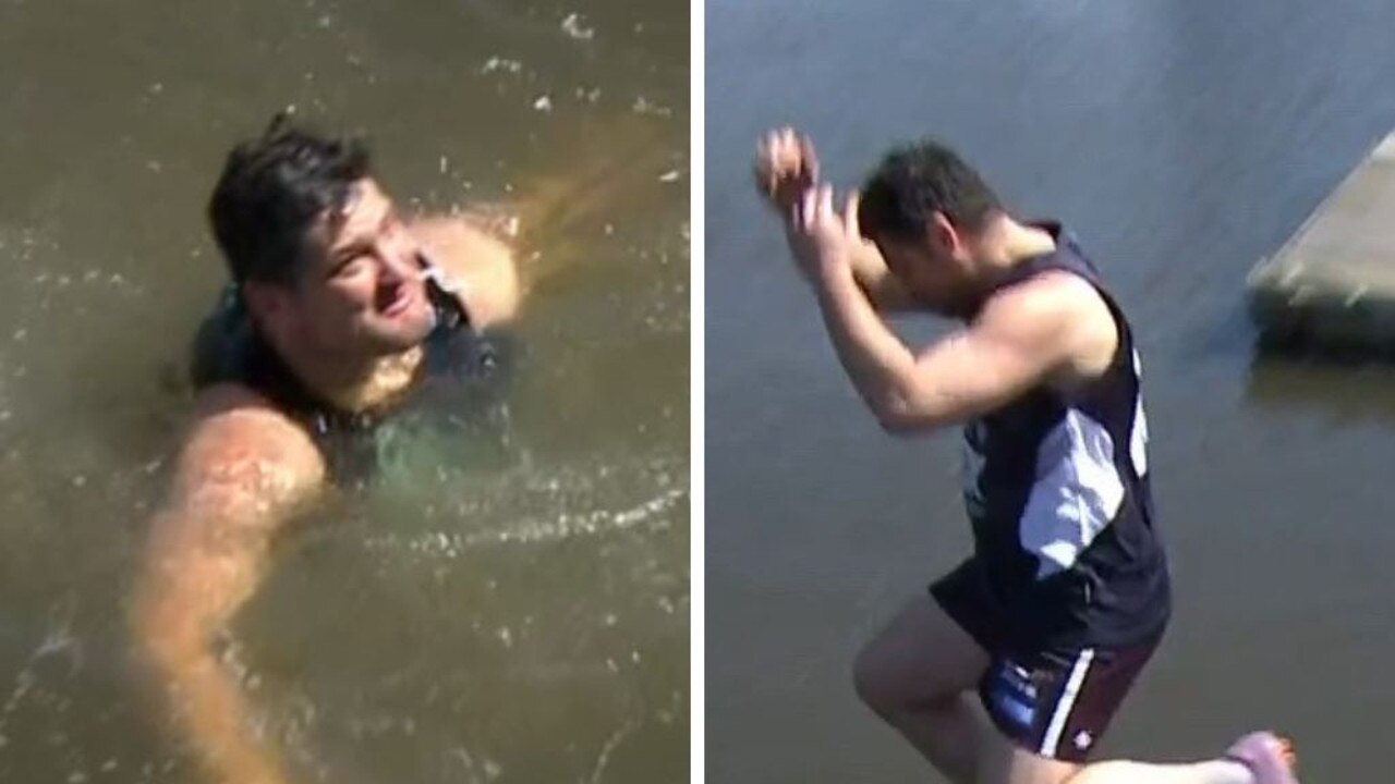 Brendan Fevola jumps into the Yarra River.