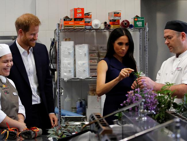 Prince Harry and Meghan enjoy a “touch, taste, smell” hands-on tour of native ingredients during a visit to Mission Australia social enterprise restaurant Charcoal Lane in Fitzroy. Picture: Phil Noble/Pool