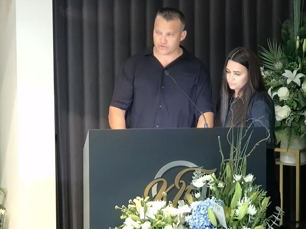 Matt Irelandes, Malcolm 'Andy' Langtree's eldest son, speaks at his father's funeral service with his wife Natasha by his side.