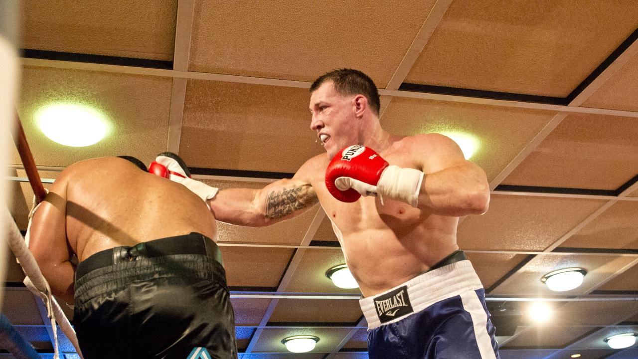 Paul Gallen and Herman Ene-Purcell fight it out in Toowoomba. Friday, Jan 29, 2016.