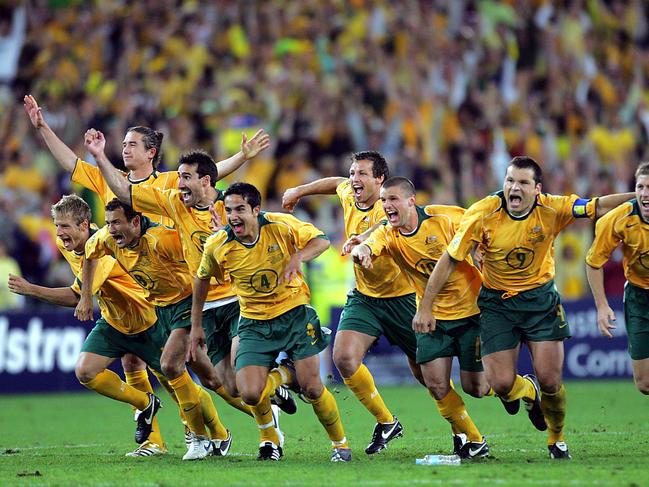 07/06/2006 LIBRARY: Socceroos players including captain Mark Viduka (7), celebrate after Australia defeated Uruguay in 2006 FIFA World Cup Qualification (2nd leg) match at Telstra Stadium, Olympic Park, Homebush in Sydney.