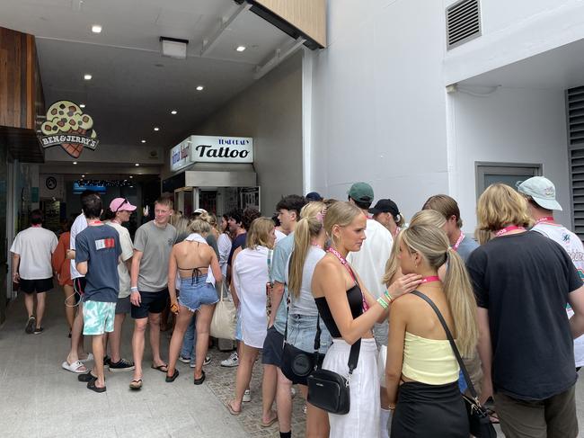 The queue at an airbrush tattoo booth in Caville Ave. Picture: Georgina Noack