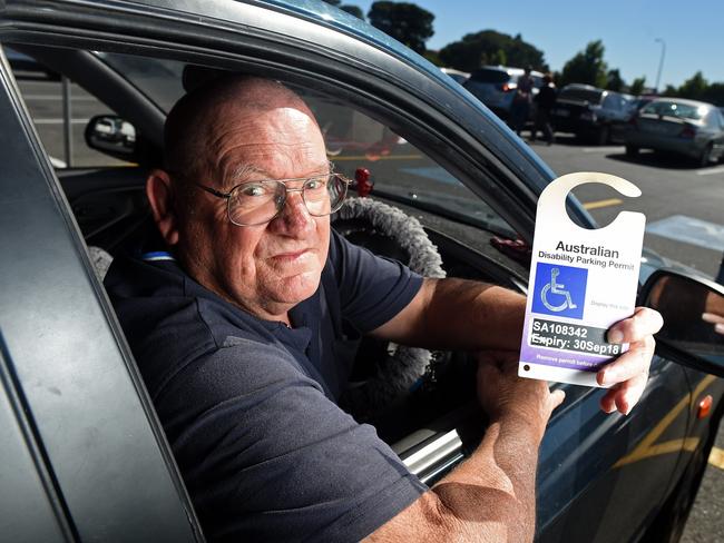 Terry Burton with his permit, said he often can’t get a disabled park at shopping centres. Picture: Tom Huntley