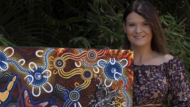 Indigenous artist Chern'ee Sutton with the artwork featured on the NRL Indigenous All Stars Jersey.