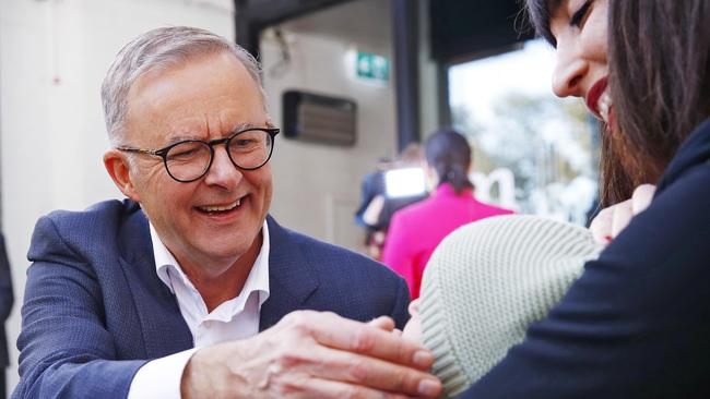 Mr Albanese meets a mum with her baby. Picture: Sam Ruttyn